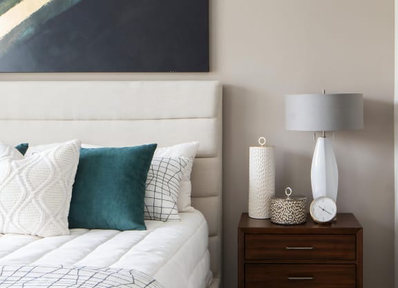 Oversized Bedroom with Padded Headboard and Designer Throw Pillows