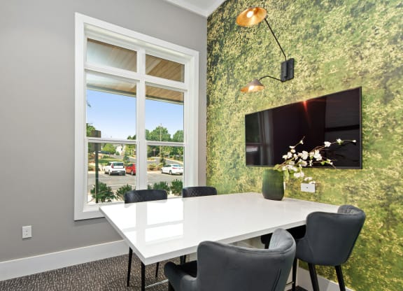 Private Conference Room with Wall-Mounted TV and Natural Light