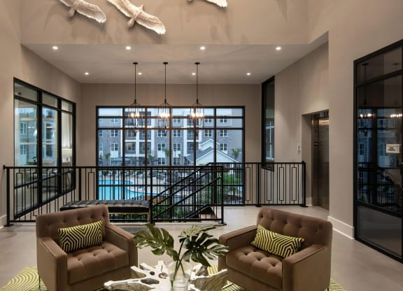 Luxe Clubhouse Lounge with Pool Views Through Floor-to-Ceiling Windows