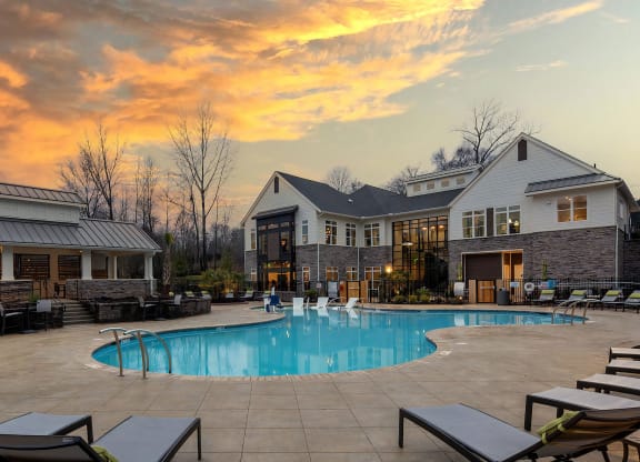 Pool with Clubhouse with Sunset Background