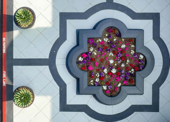 Stylish Garden Courtyard with Colorful Blooms at Villas at the Gardens