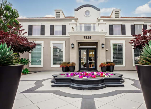 Villas at the Gardens Leasing Office Entry with Elegant Landscaping and Planters