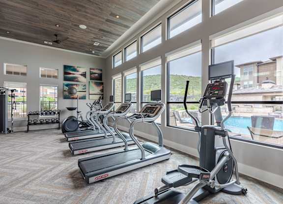 Fitness Center With Treadmills, Elliptical Machines, And Weight Rack