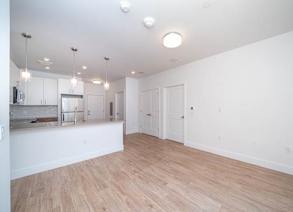 Open concept living room and kitchen at Port & Main Apartments, New York, 10573