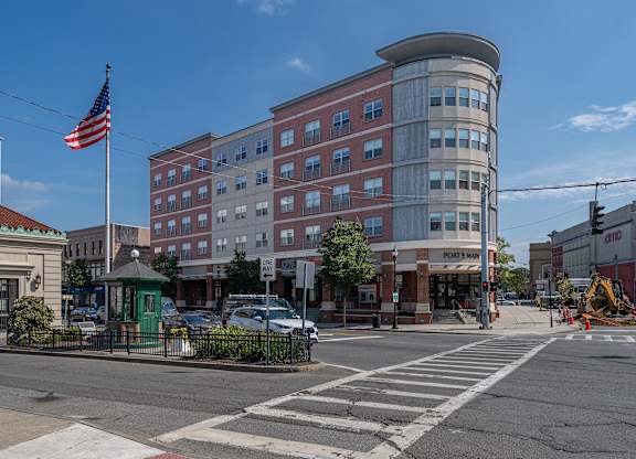 Street view of mixed use building with retail at Port & Main Apartments, Port Chester, New York