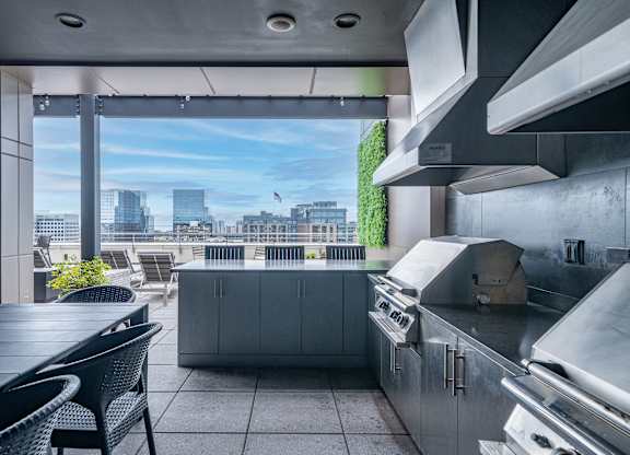 A modern kitchen with a view of the city.