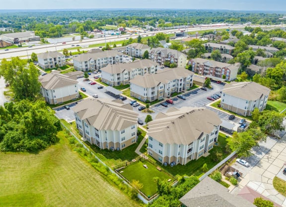an aerial view of a row of houses in a suburban neighborhood