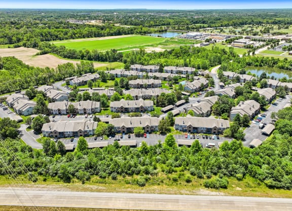an aerial view of a neighborhood with houses and trees