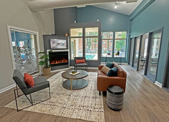 a living room with blue walls and a fireplace