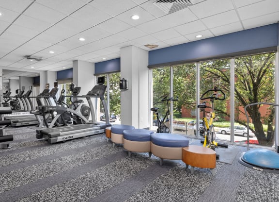 a fitness center with treadmills and other exercise equipment
