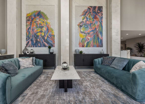 a living room filled with furniture and a large painting of a lion