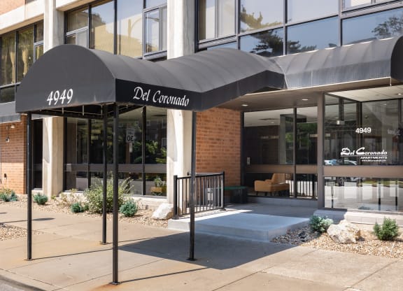 the front of a building with a black awning