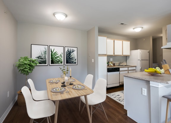 an open kitchen and dining room with a table and chairs