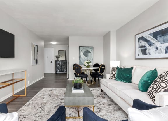a living room with grey walls and a white couch