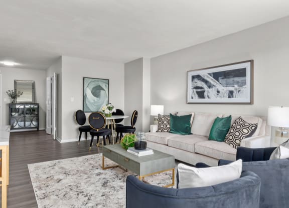 a living room with gray walls and a white couch
