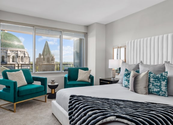 a bedroom with a large bed and a window