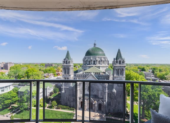 a balcony with a view of a large building