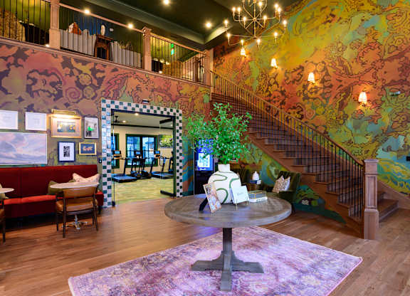 A living room with a staircase and a couch.
