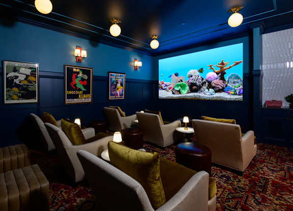 Theater room with aquarium and lounge seating at Fairmont Apartments, Westerville, OH 43081