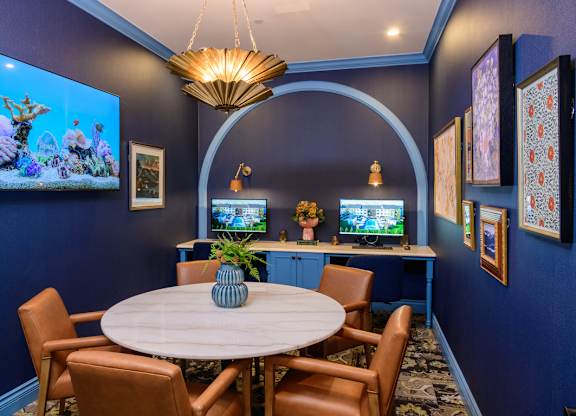 Conference room with dual workstations and round table at Fairmont Apartments, Ohio, 43081