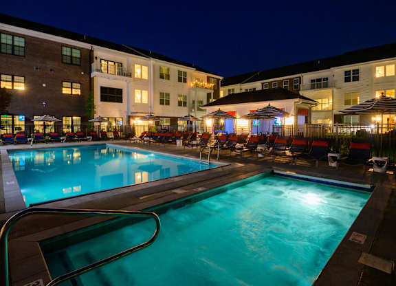 Evening pool area with spa and illuminated courtyard at Fairmont Apartments, Westerville, OH 43081