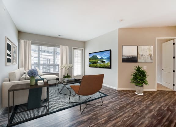 a living room with a tv on the wall at Essex, Columbus, Ohio, 43212