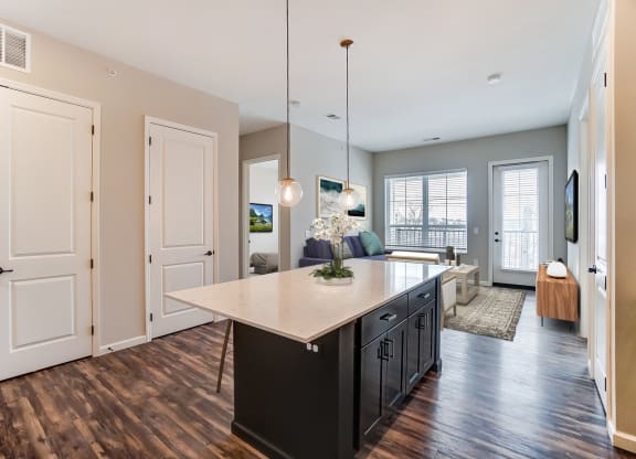 an open kitchen with an island and a living room at Essex, Columbus, Ohio