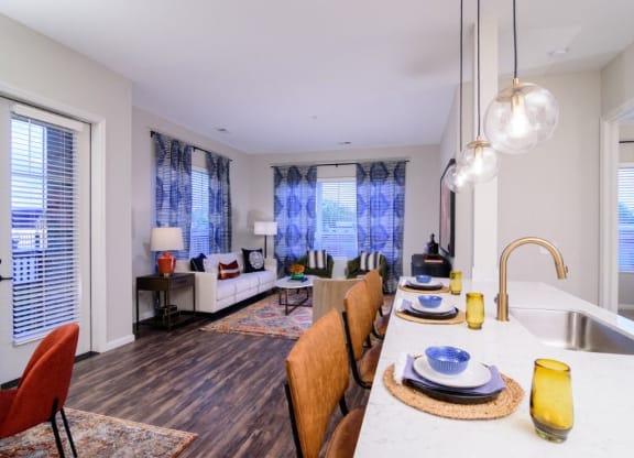 a kitchen and living room with a large table and a sink at Essex, Columbus, 43212