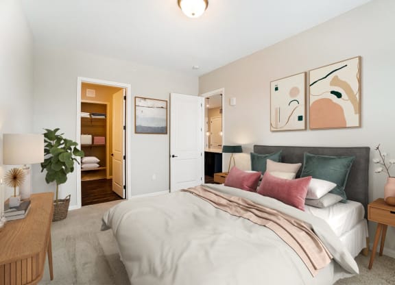 a bedroom with a bed and a door to a bathroom at Essex, Columbus, Ohio, 43212