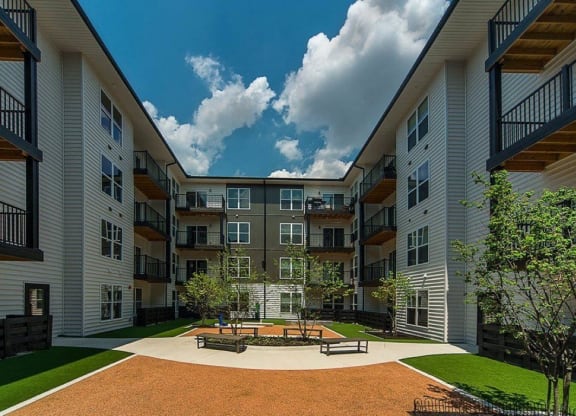 a courtyard in the middle of an apartment building at Taylor House Apartments, Columbus, OH, 43214