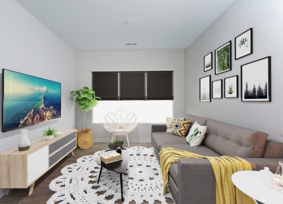a living room with a gray couch and a yellow blanket at Fairfax, Ohio, 43212