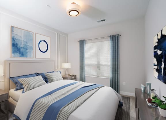 a bedroom with a large bed and two night stands with lamps at Fairfax, Grandview, OH