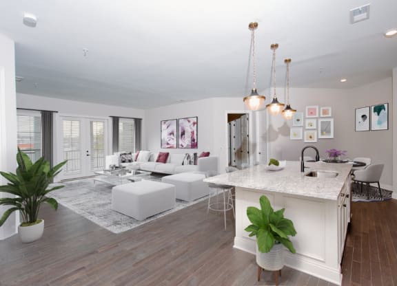 a kitchen and living room with white walls and wood floors at Fairfax, Grandview