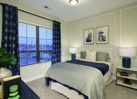 a bedroom with gray walls and a large window with blinds at Fairfax, Ohio, 43212
