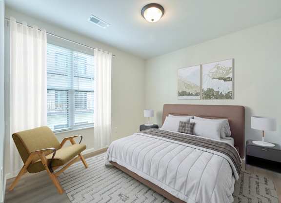A bedroom with a bed, chair, and two pictures on the wall.