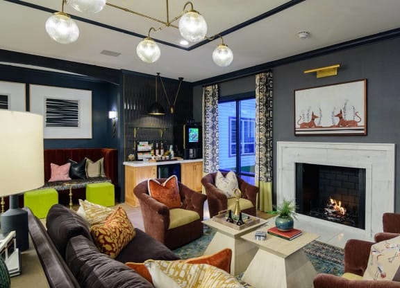 a living room filled with furniture and a fire place at Essex, Columbus, OH