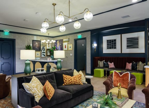 a living room filled with furniture and a large window at Essex, Columbus, 43212