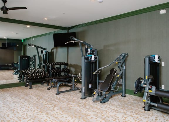 a room filled with lots of different types of exercise equipment at Fairfax, Grandview, 43212