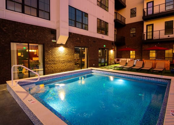 a swimming pool in front of a building at Fairfax, Grandview