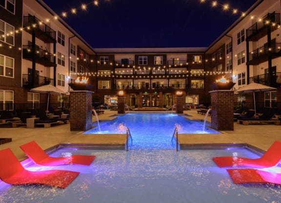 the pool at the hotel is lit up at nightat Taylor House Apartments, Columbus, Ohio
