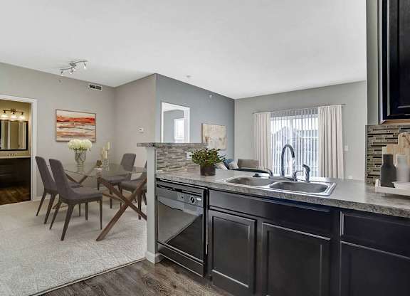A modern kitchen with a dark wood finish.