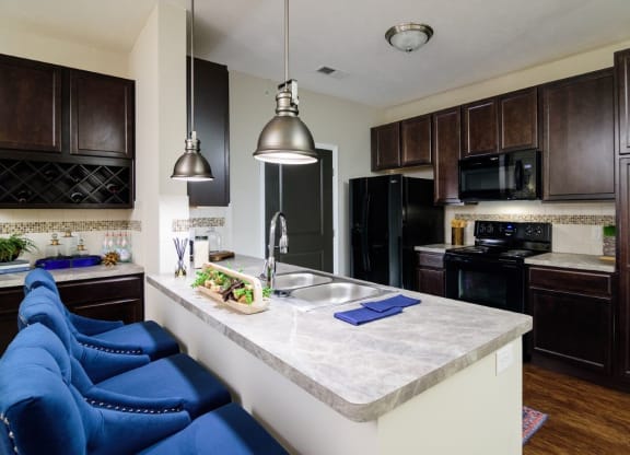 a kitchen with black appliances and a white counter top at Taylor House, Columbus, 43214
