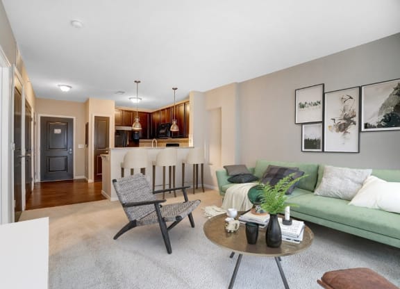 a living room with a couch and a tableat Taylor House Apartments, Columbus, OH, 43214