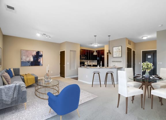 a living room and kitchen with a table and chairsat Taylor House Apartments, Columbus