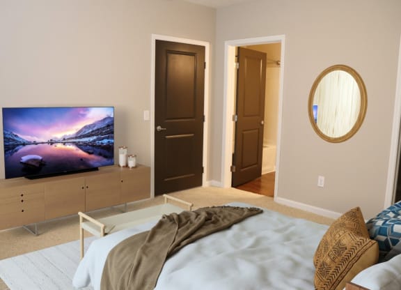 a bedroom with a bed and a tv in it