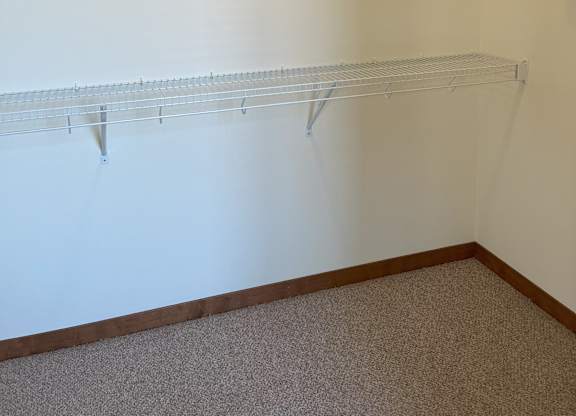 Empty room with two shelves at Cornerstone & Ravenna* Apartments, Shorewood