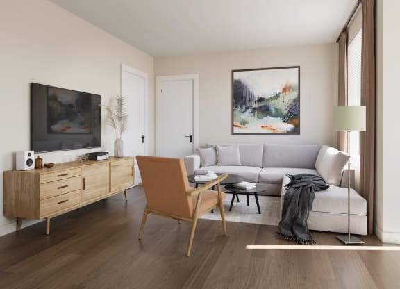 a living room with hardwood floors and white walls