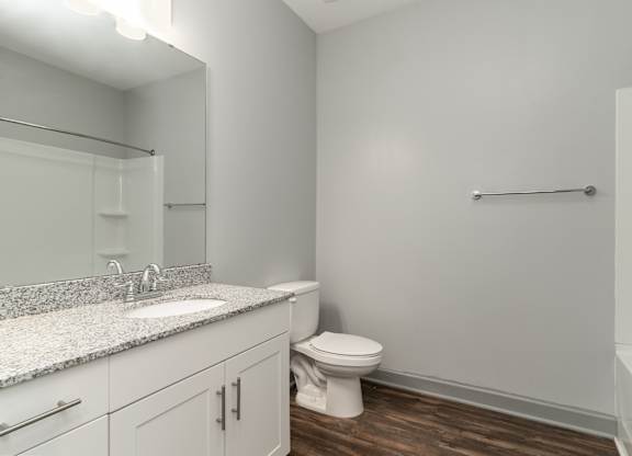 Bathroom with a toilet sink and bathtub at The Parker Myrtle Beach, South Carolina, 29588