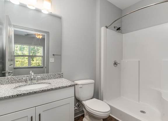 Bathroom with a bathtub toilet and sink at The Parker Myrtle Beach, Myrtle Beach, SC