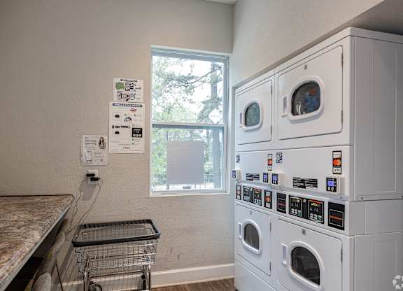 A Laundry Room With a Washer and Dryer at Avondale Place Apartments, Georgia, 30002